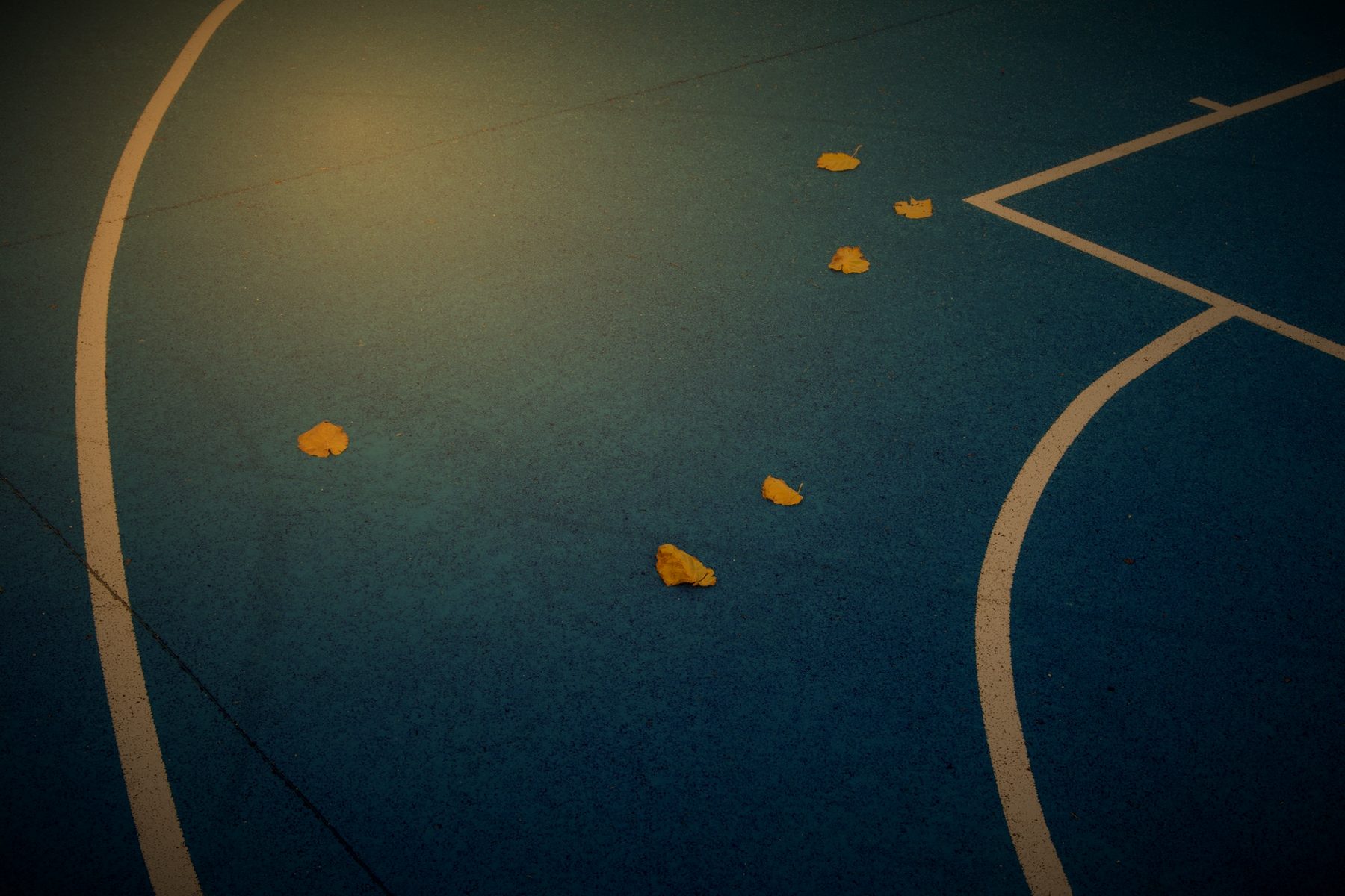 Three point line and paint on an outdoor court surface
